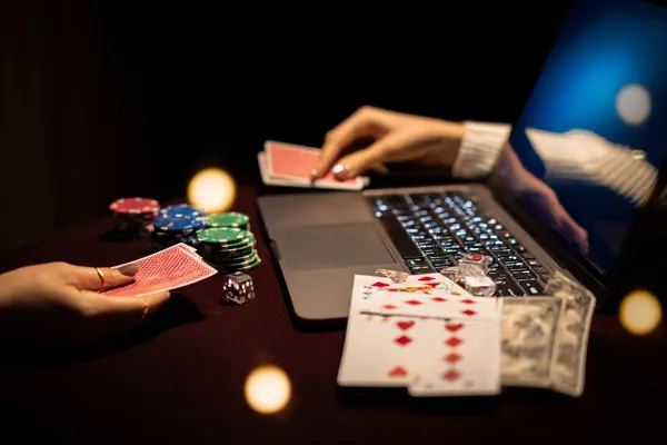 A player using their smartphone during a festive local event, representing LEGIONBED’s fully mobile-friendly casino.